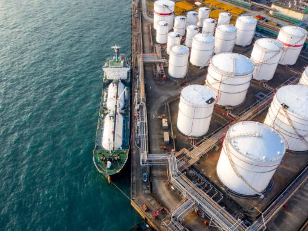 Massive oil tanker at sunset